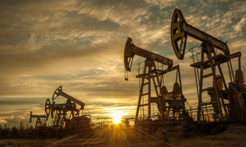 stock-photo-oil-pump-jacks-at-sunset-sky-background-toned-316001336